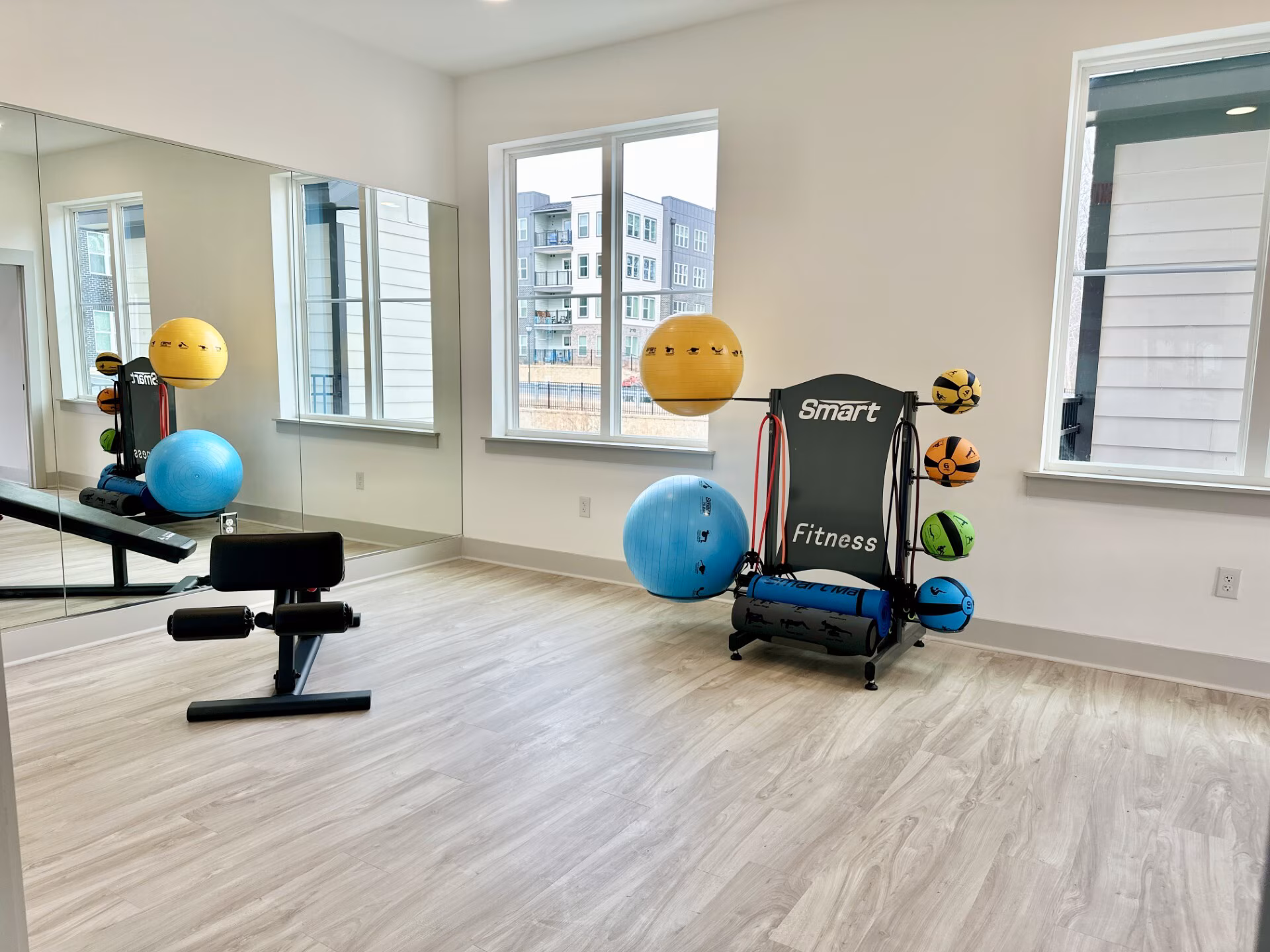 Stretch and yoga corner with stability balls and a mirror