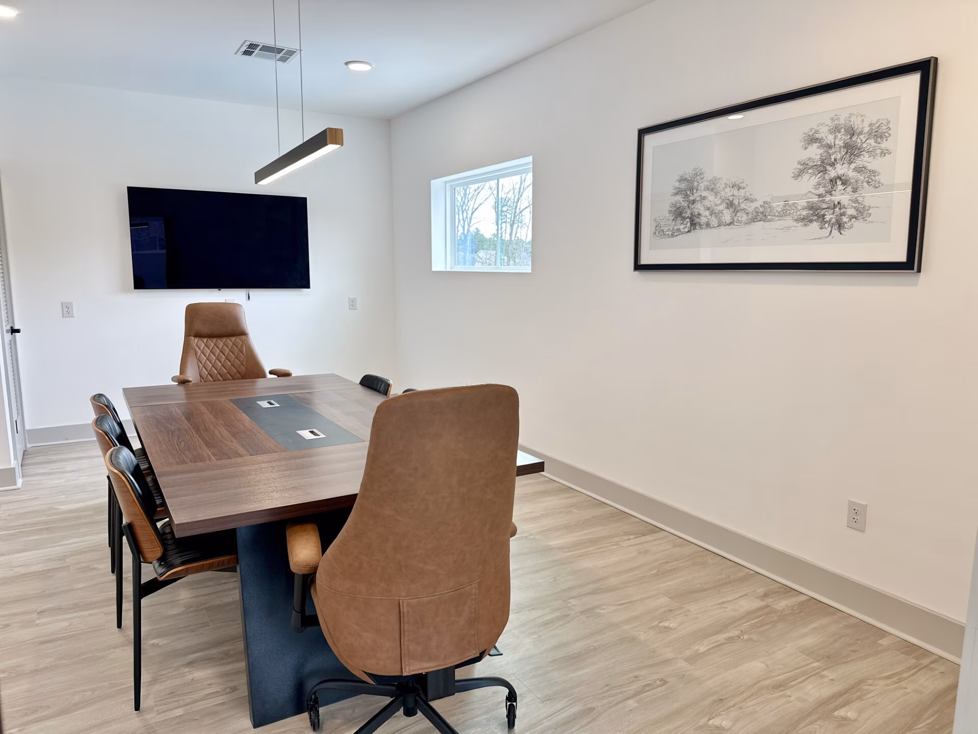 Conference room with a boardroom table and display