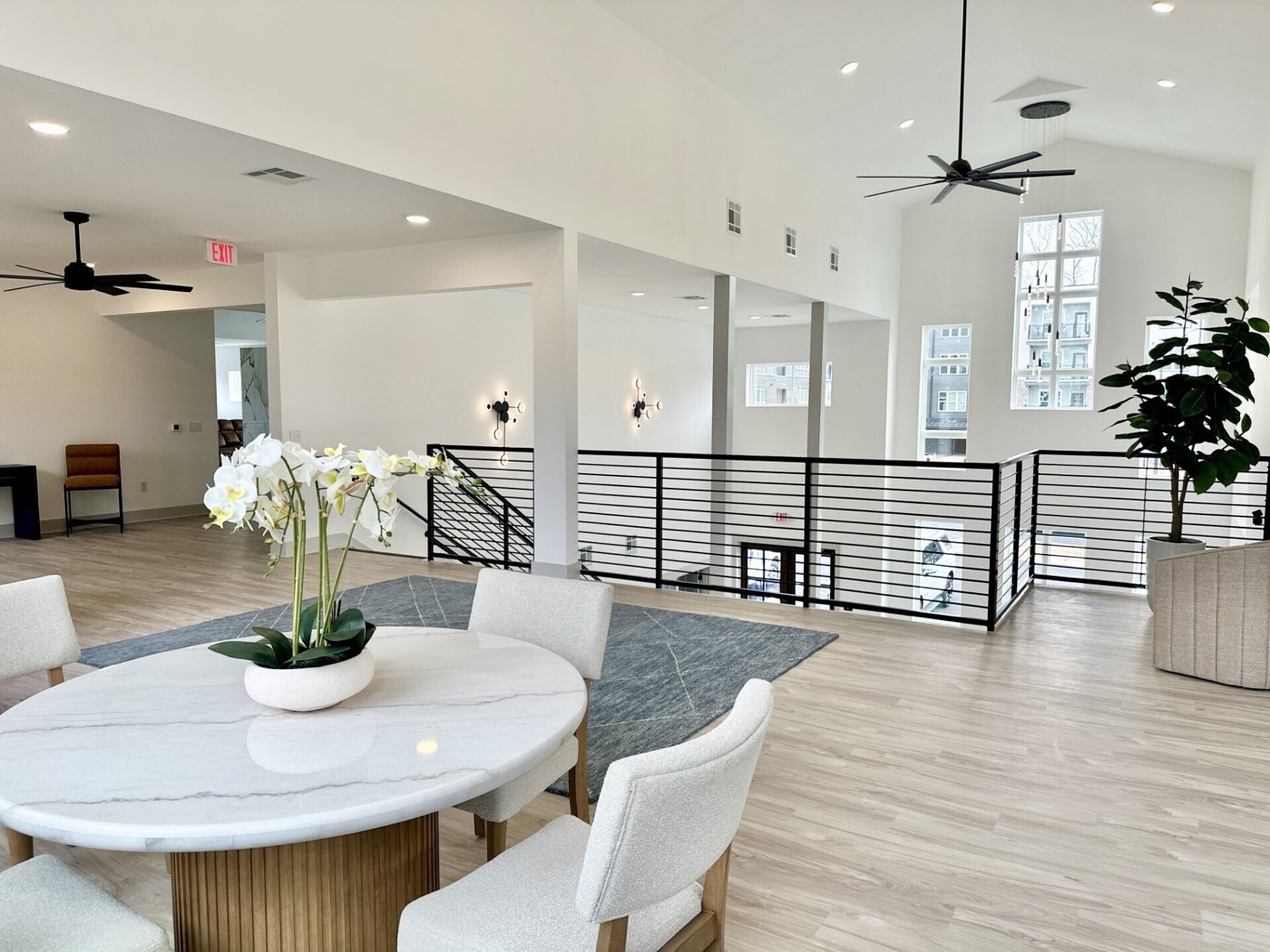 Marble dining table set beneath the mezzanine