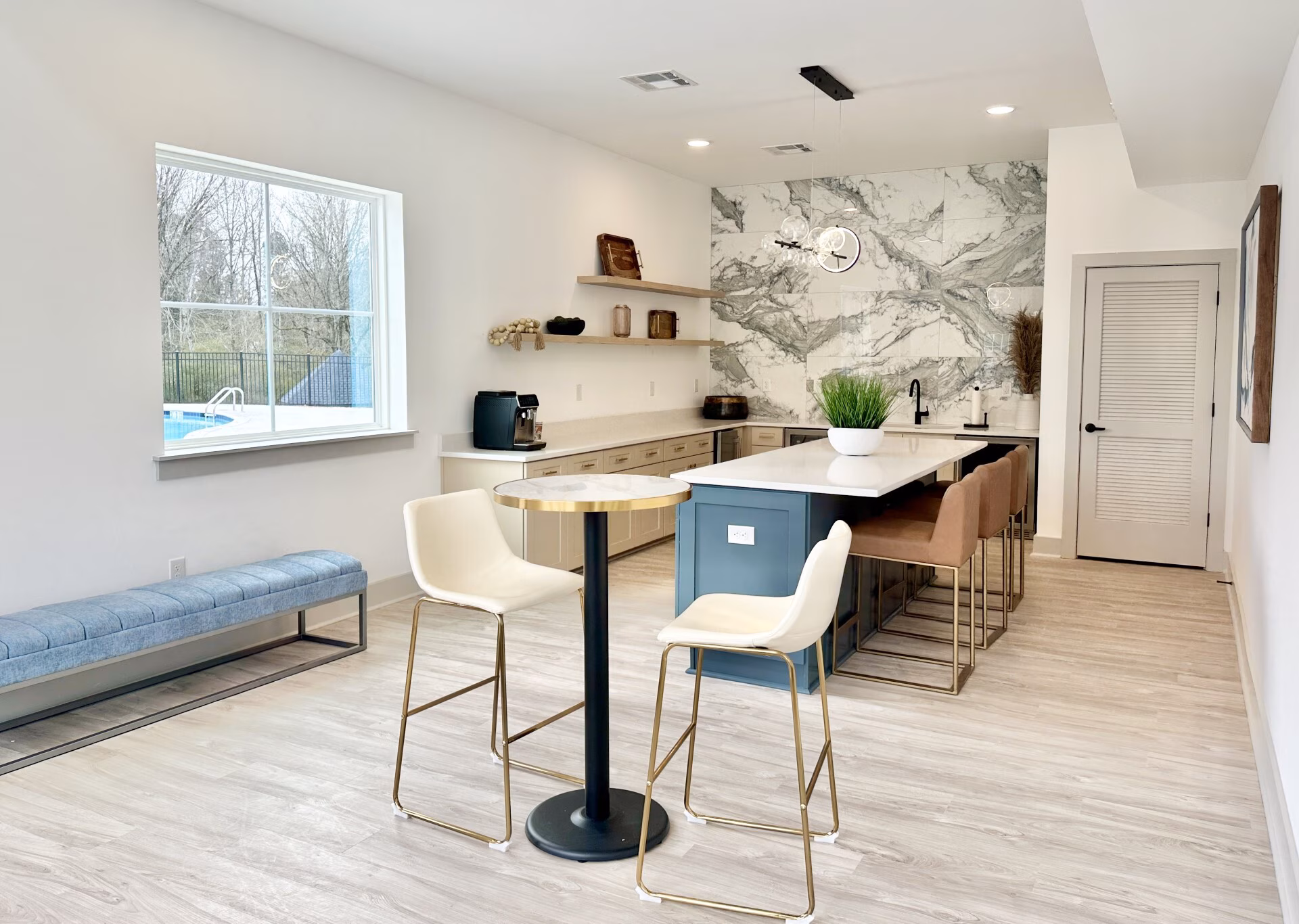 Coffee bar with an island and marble backsplash