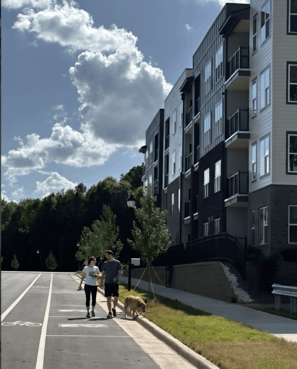 Walking the greenway beside the buildings at Aria at Idlewild